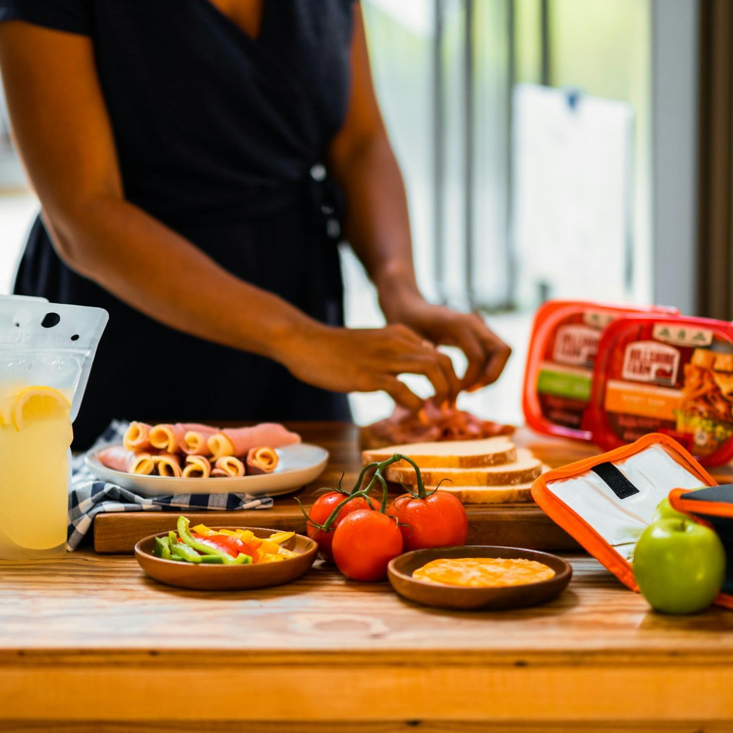 Diverse group of community members sharing a meal together, showcasing the social bonds formed through collaborative cooking